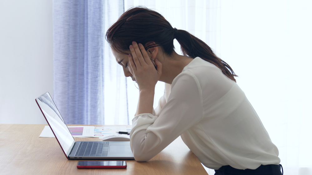 Image of a woman working at laptop