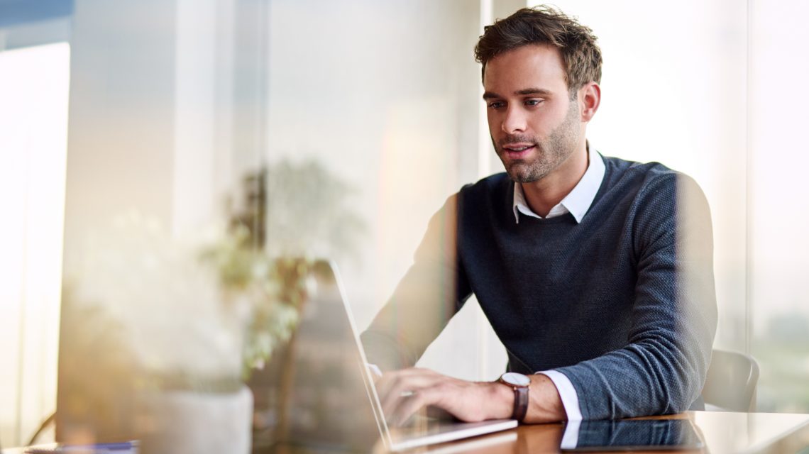 Image of man working at laptop